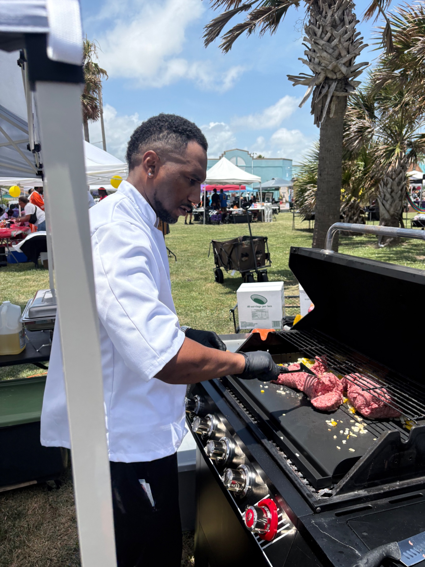 Arthur Bolton cooking on the line at a True Growth event