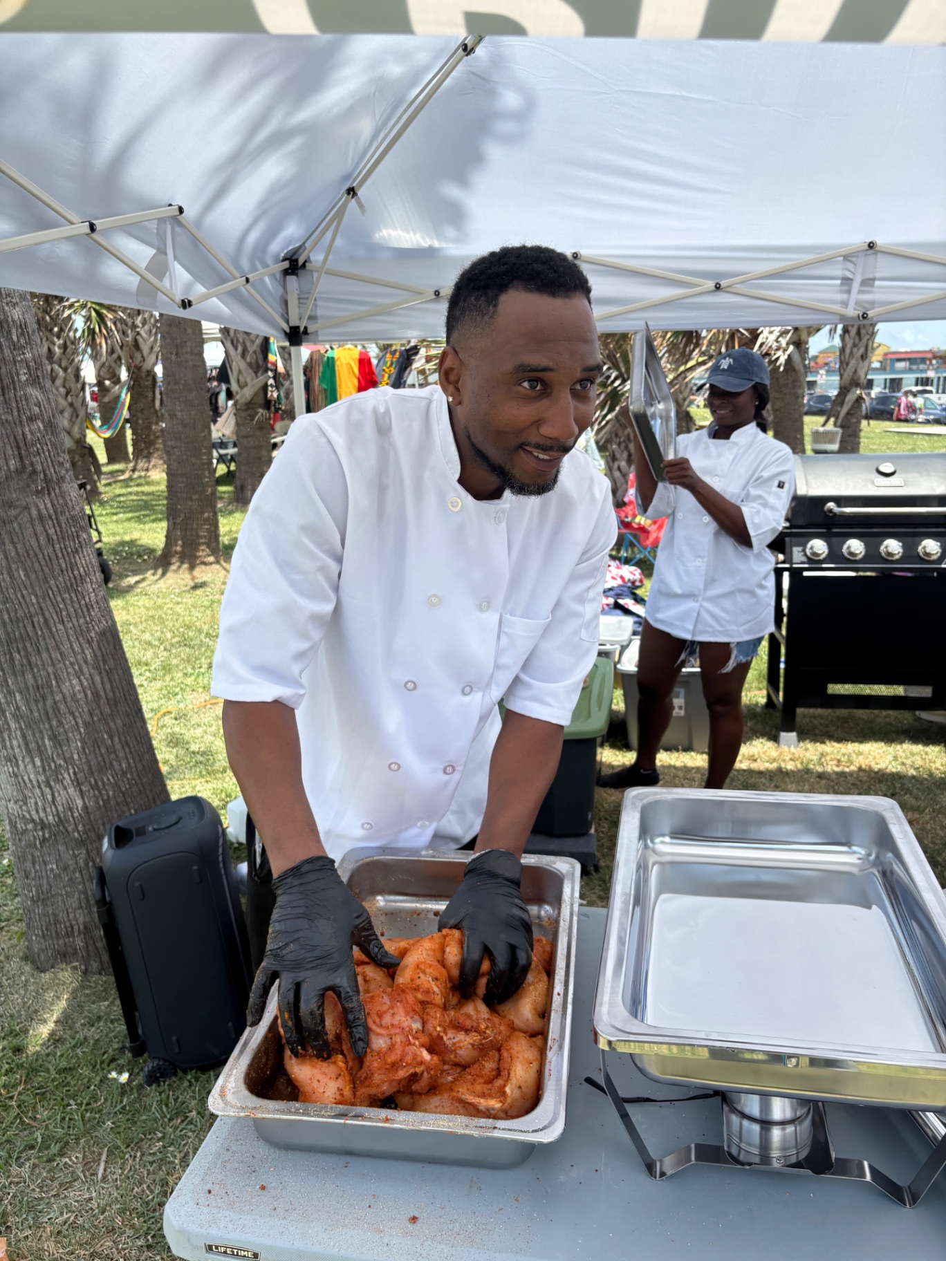 Arthur Bolton prepping seasoned chicken before service