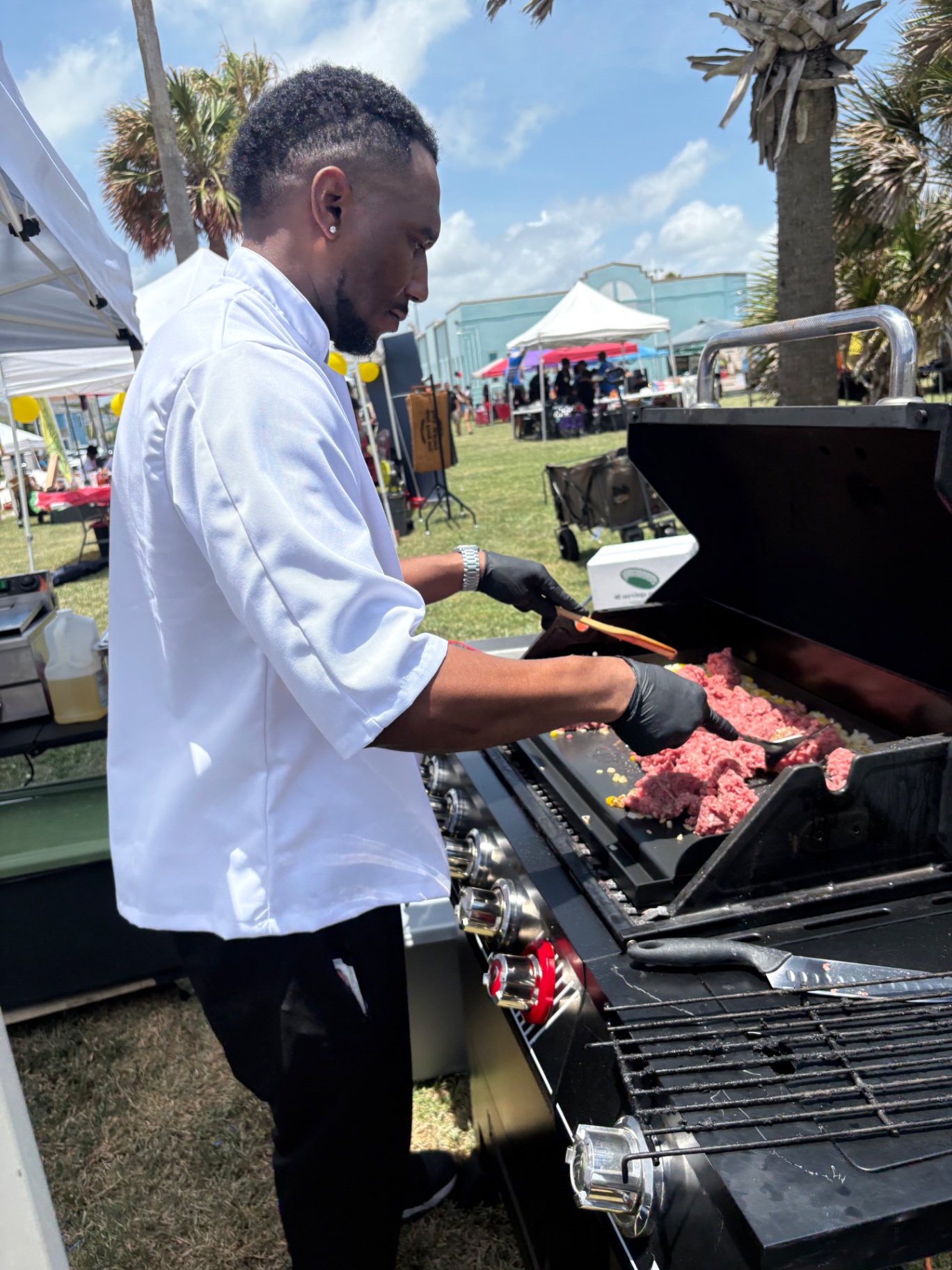 Arthur Bolton working the grill line at a True Growth event